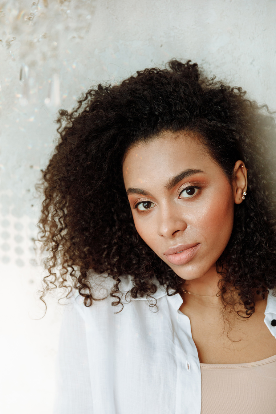 Portrait of Beautiful Woman with Curly Hair