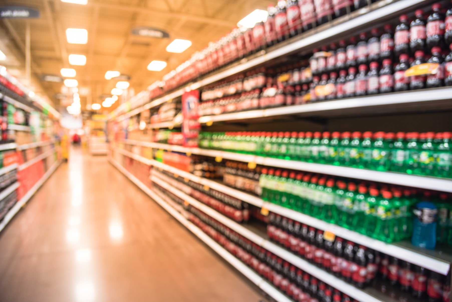 Abstract blurred soft drinks aisle in American store